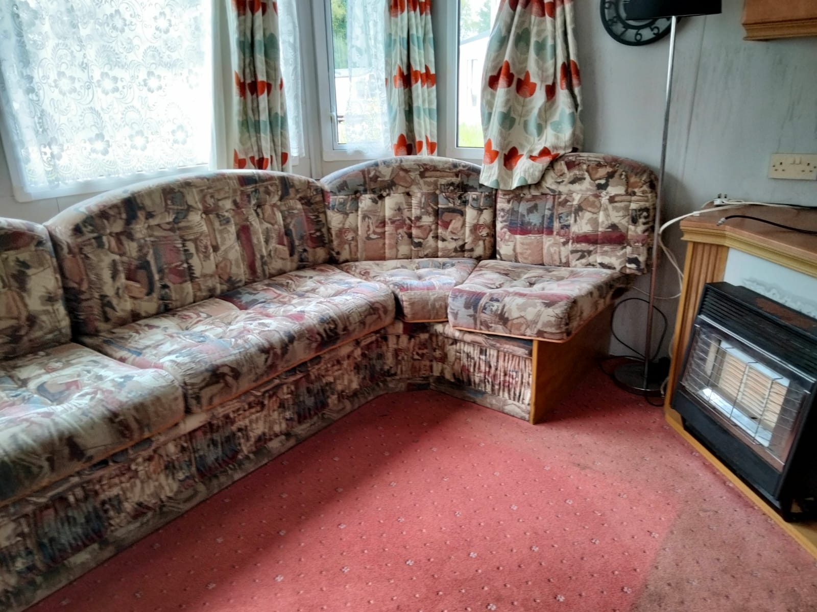 Corner sofa and gas fire in the lounge of a Willerby Westmorland