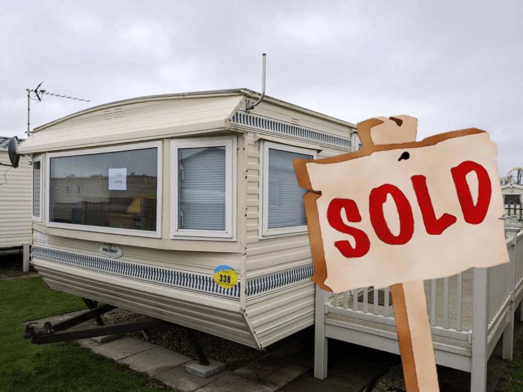 A Willerby Granada static caravan on its pitch, with the original website's SOLD sign