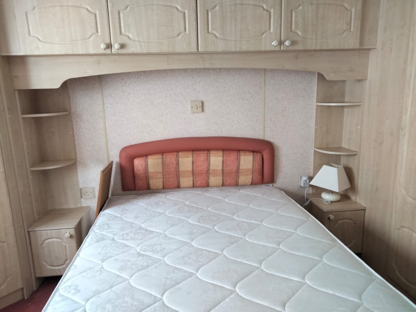 Double bedroom with overhead cupboards in the Westmorland
